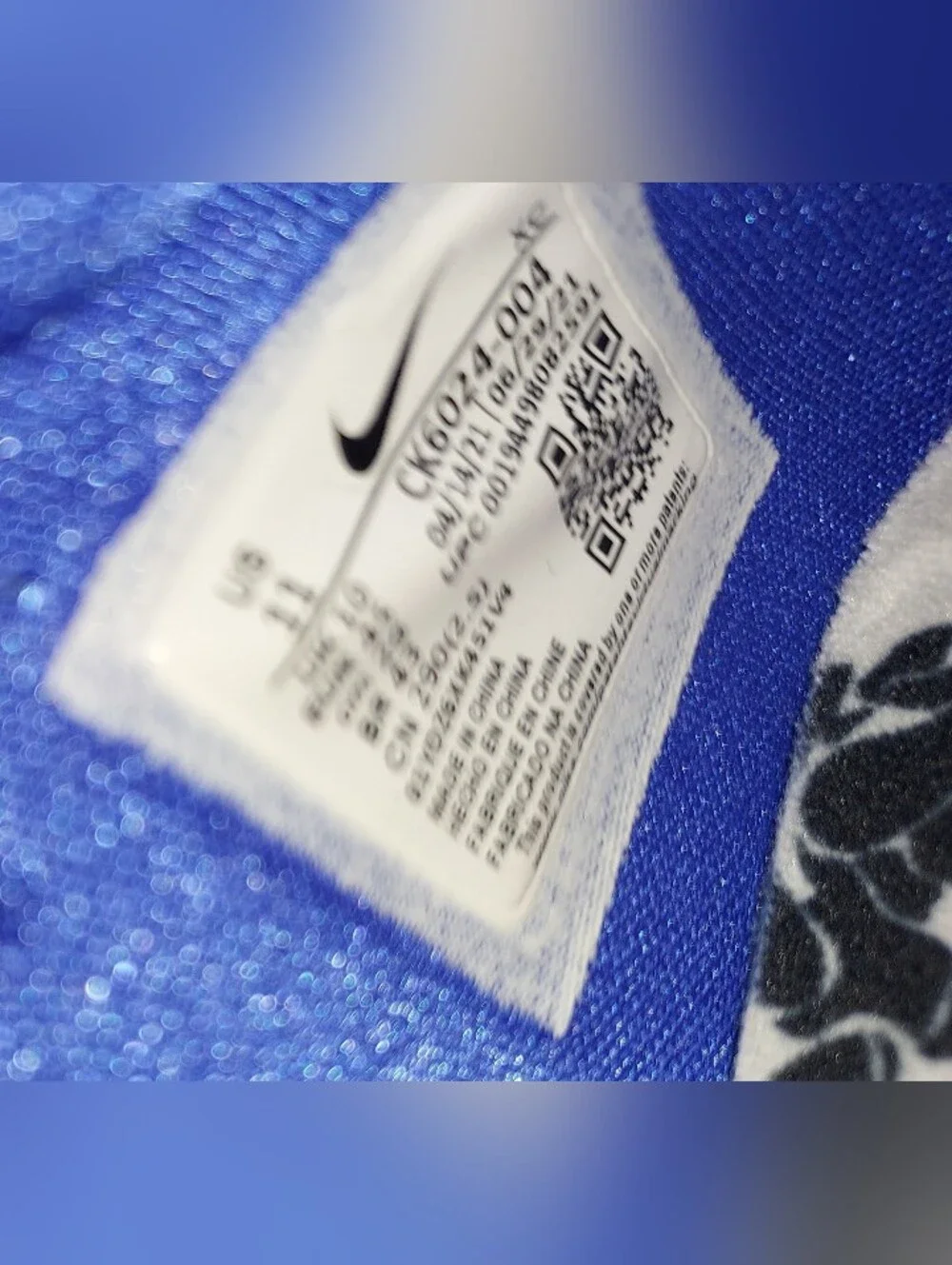 Nike Men’s White Floral Training Shoes with Black Print and Blue Details